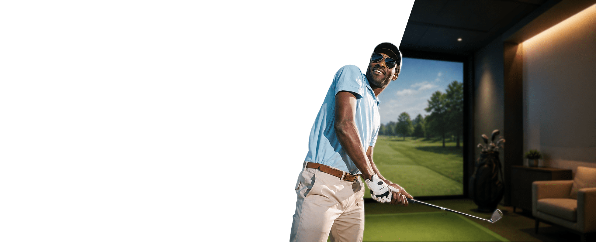 A golfer in a blue shirt swings a golf club indoors, with a virtual golf course displayed behind him, highlighting modern training technology.